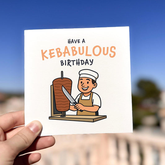 Have A Kebabulous Birthday Card card being held outdoors, showing front design clearly.