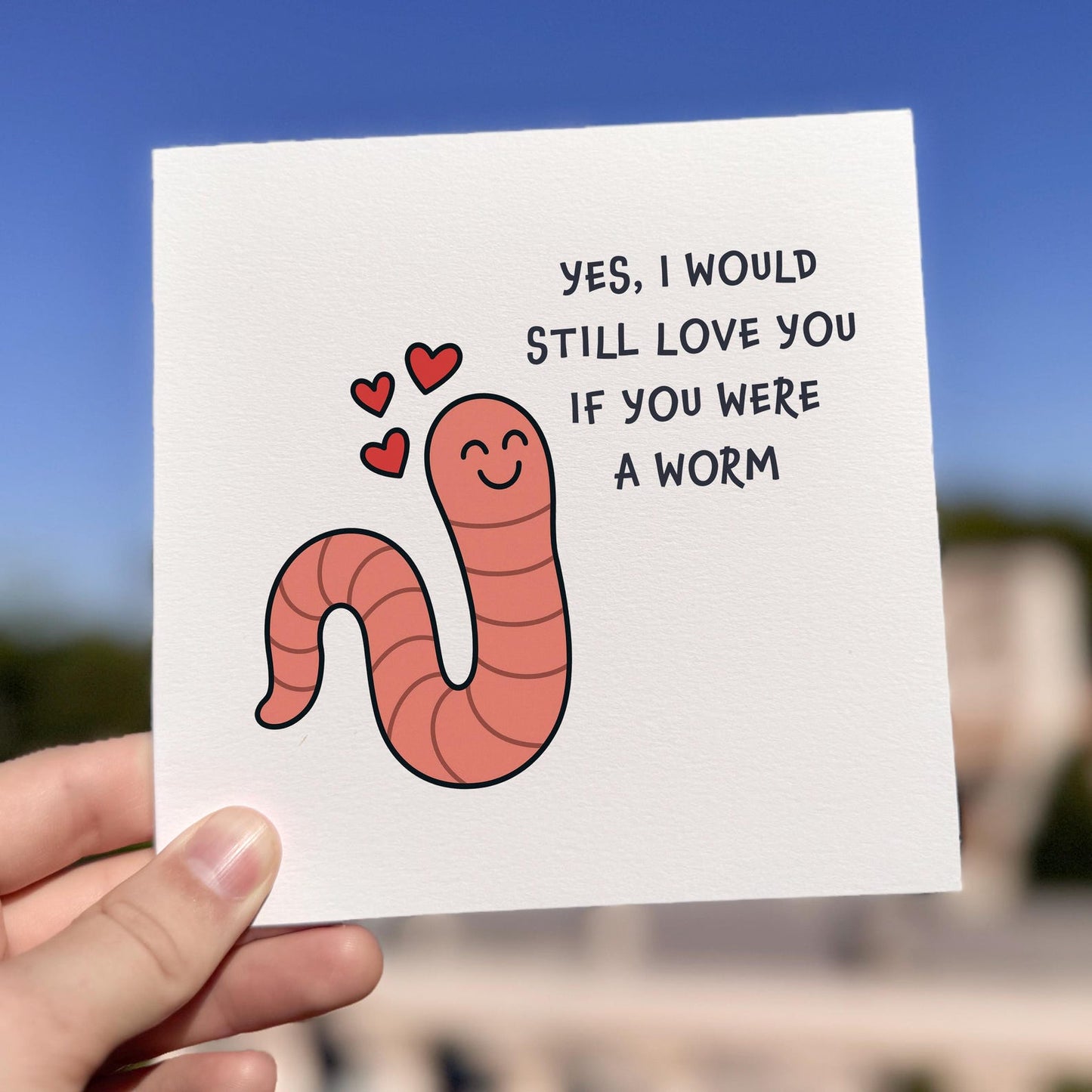 Funny love card featuring a smiling cartoon worm with hearts and the text ‘I Would Still Love You If You Were A Worm’.