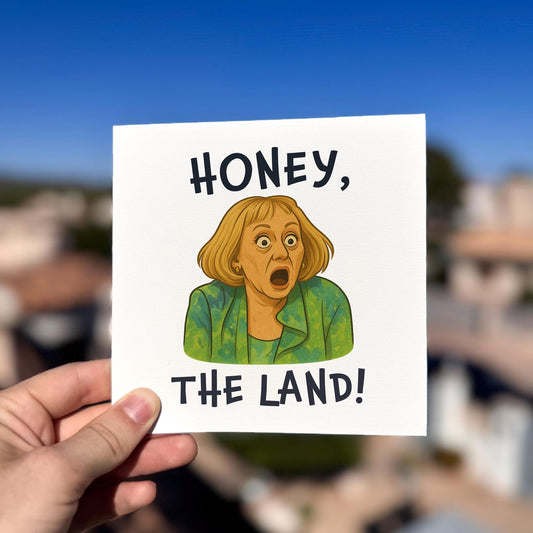 Honey The Land Funny Birthday Card card being held outdoors, showing front design clearly.