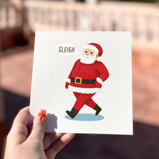 Funny Christmas card featuring Santa confidently strutting with the word ‘Sleigh’.