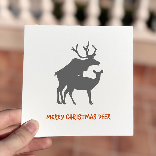 Funny Christmas card featuring two deer silhouettes and the phrase ‘Merry Christmas Deer’.