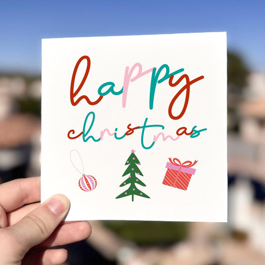 Modern Christmas card featuring colourful typography and festive icons with the text ‘Happy Christmas’.