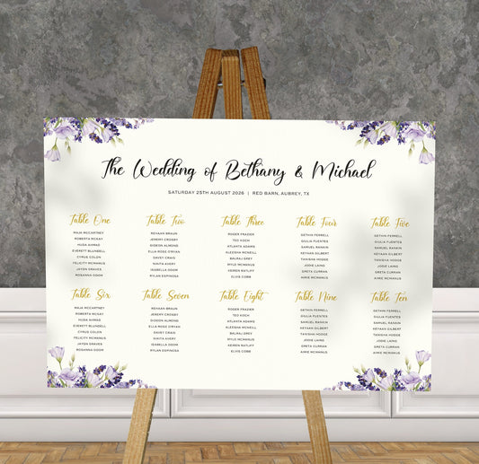 purple lavender wedding Table Plan on a brown easel in a stylish room in a wedding venue